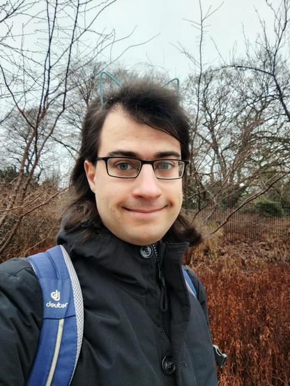 outside selfie of me wearing plastic cat ears