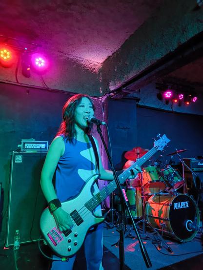 Atsuko Yamano performing with Shonen Knife at Centro Cultural BULA, Buenos Aires.