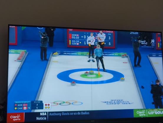 My TV showing the Olympic Games broadcast of the mixed doubles curling match of Norway vs Canada