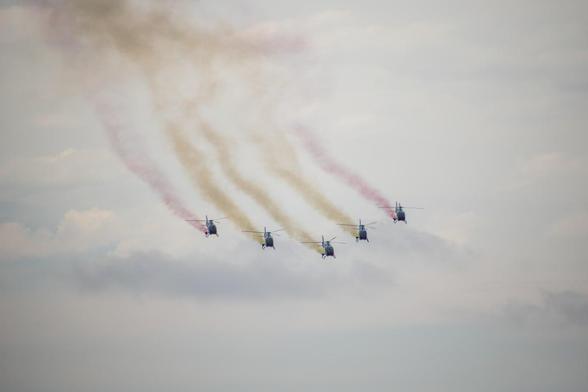 Five EC120 from Patrulla Aspa making the Spanish flag with smoke