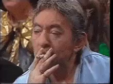 Serge Gainsbourg crying while smoking