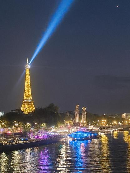 A picture of Paris at night with the Eiffel Tower