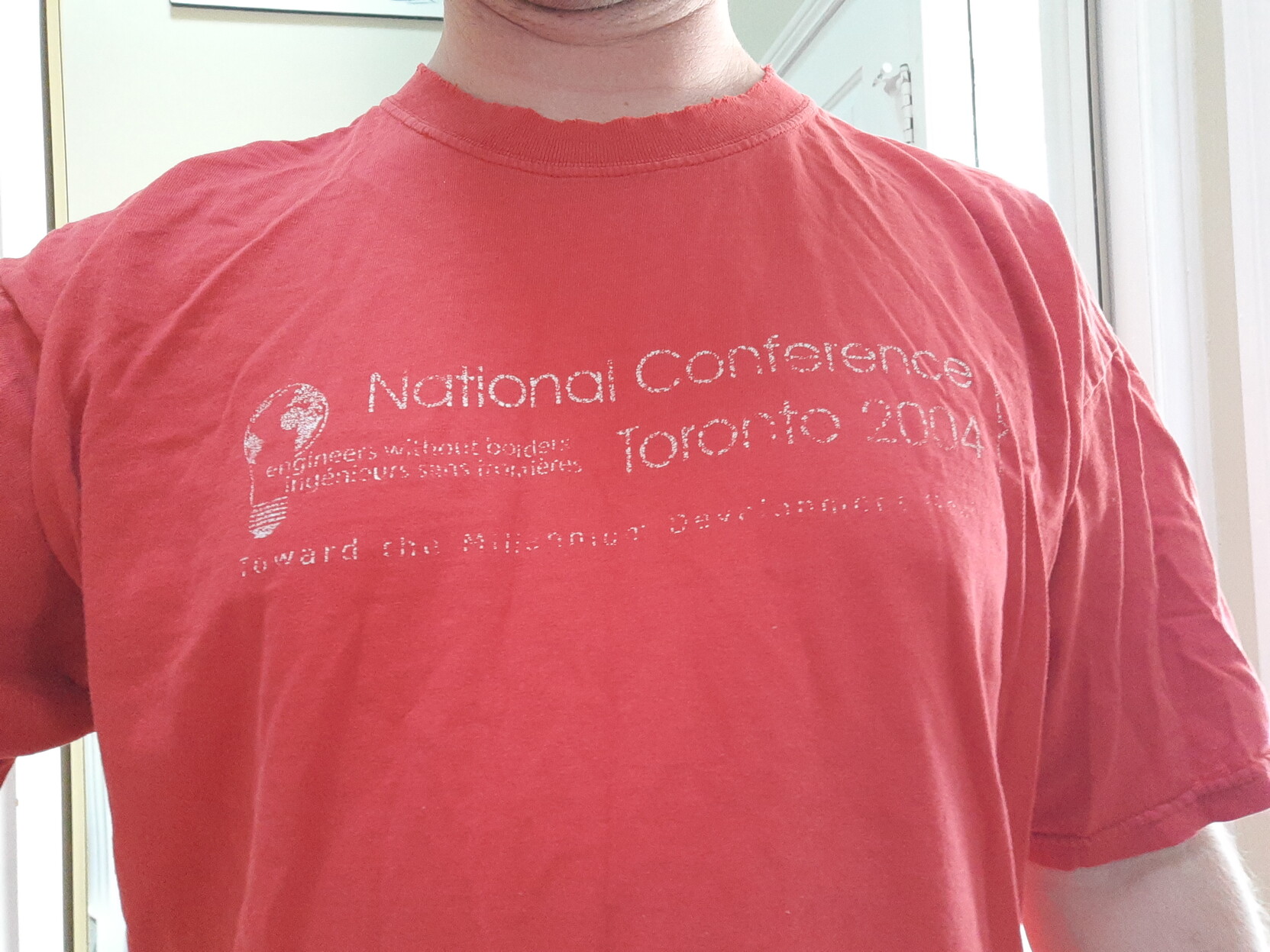 Faded red Tshirt from the Engineers Without Borders National Conference in Toronto 

2004