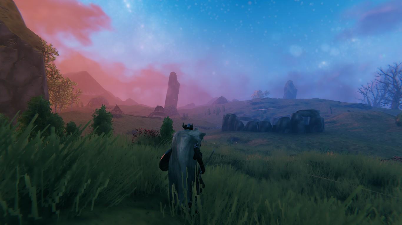 Screenshot from the game Valheim.

Stabby is looking at the henge that houses his Plains farm.

The sun is setting to the left and night is creeping in from the right. The henge is a little to the right off center, mostly visible as a heap of stones. There are some Plains pillars in the distance and one of the huge boulders at the very left edge.

The sky is a vivid red to the left and soft blue to the right. It's a gentle evening in a biome that can be very unforgiving.