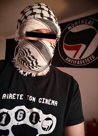 A person covering their face with a keffiyeh.