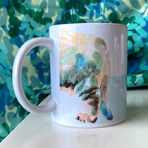 White, glossy mug with its handle to the left. Printed on the mug is a cat's rear half, with two back legs and droopy tail. It is a watercolour illustration digitally printed on the mug.