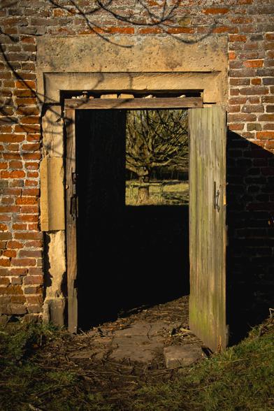 Door in the garden wall, looking outside.