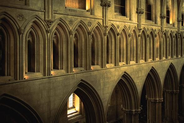 Detail of the north side of the Cathedral nave showing the triforium, a series of small arched windows, above the main arches at ground level.