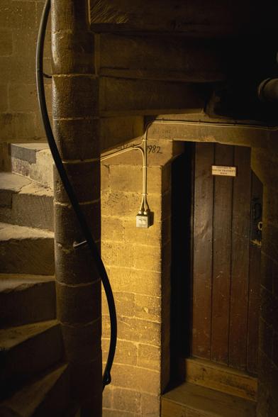 Spiral staircase and wooden door.