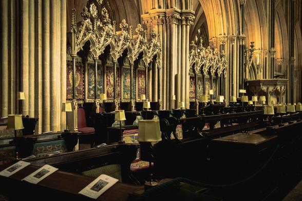 Interior of Wells cathedral: the ornate choir stalls.