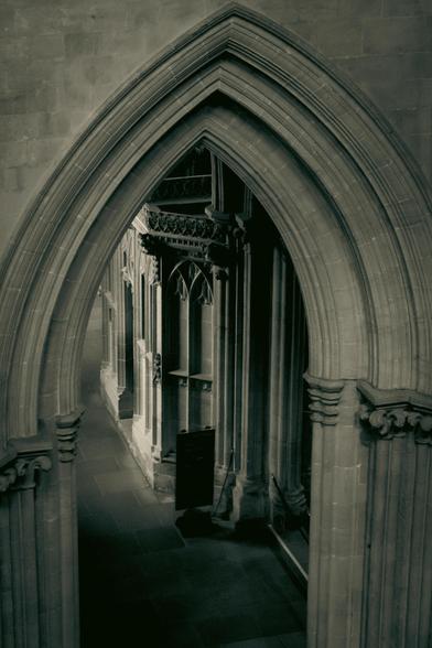 Looking down in the cathedral through an arch.