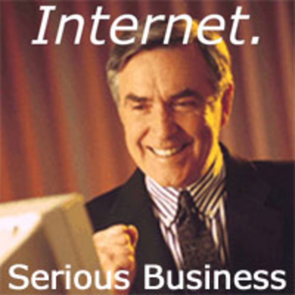 Internet. Serious business. (Business man pumping fist and smiling at computer.)