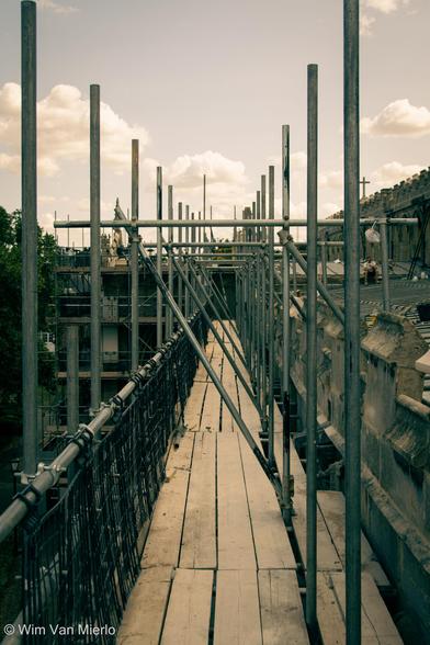 Up on scaffolding along the church roof.